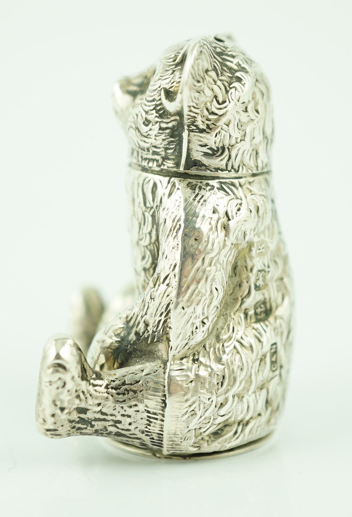 An Edwardian novelty silver pepperette modelled as a seated bear, Crisford & Norris